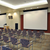 multipurpose room with chairs and screen