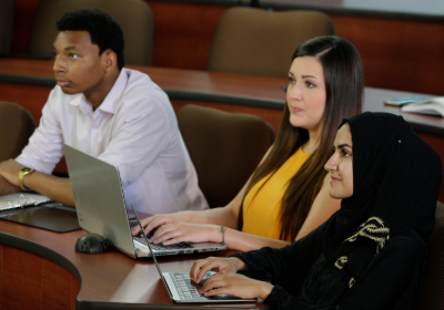 Students in classroom with laptop