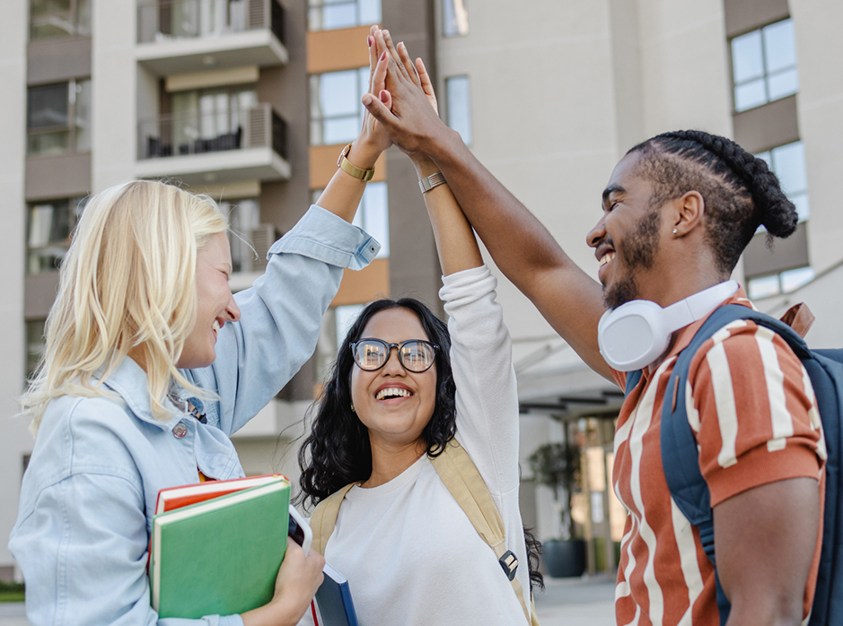 Students giving each other a high five.