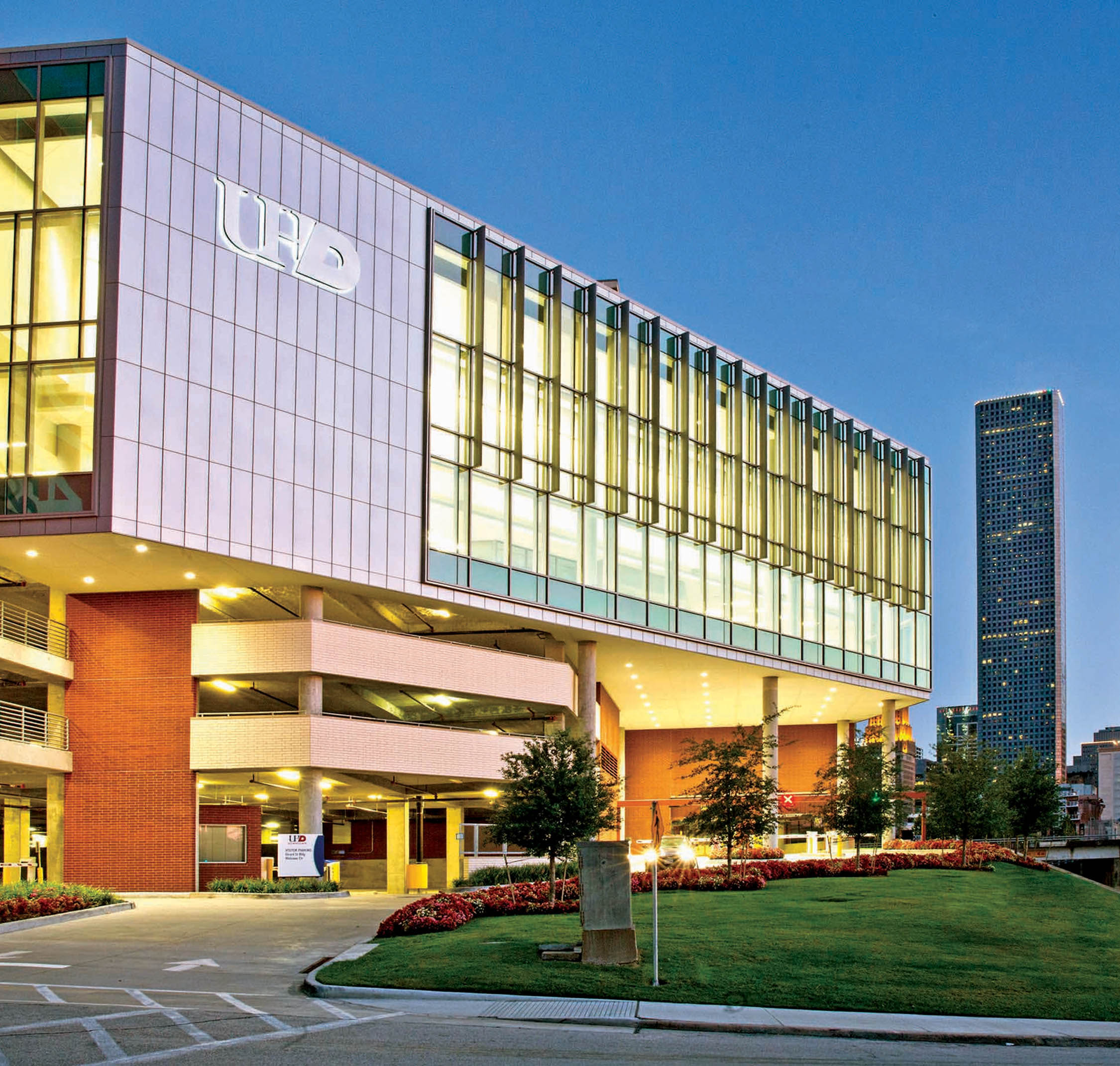UHD Welcome Center building and Houston skyline at night