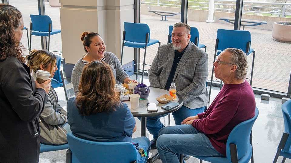 Employees of UHD enjoying breakfast and company