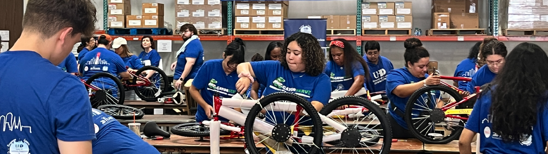 image of students assembling bikes at GatorServe