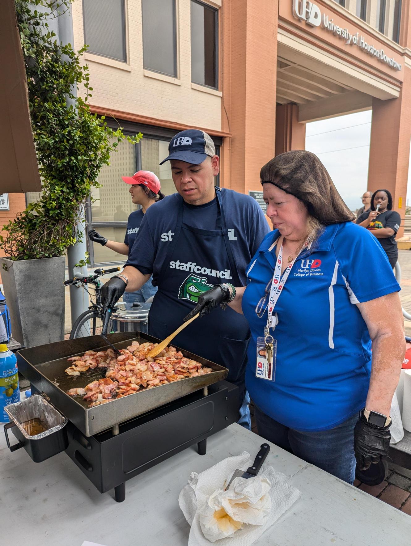 Staff council cooking chili.