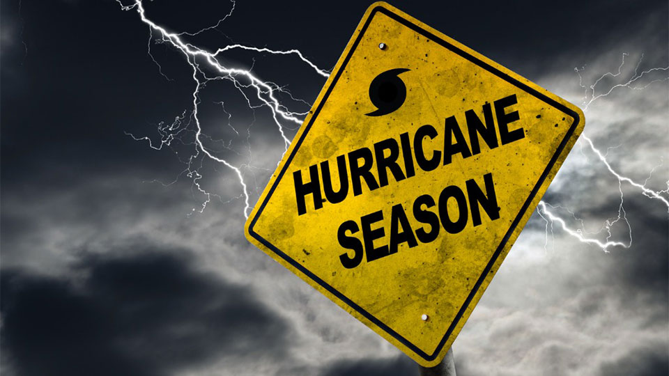 Hurricane Season Sign, with lighting in the background