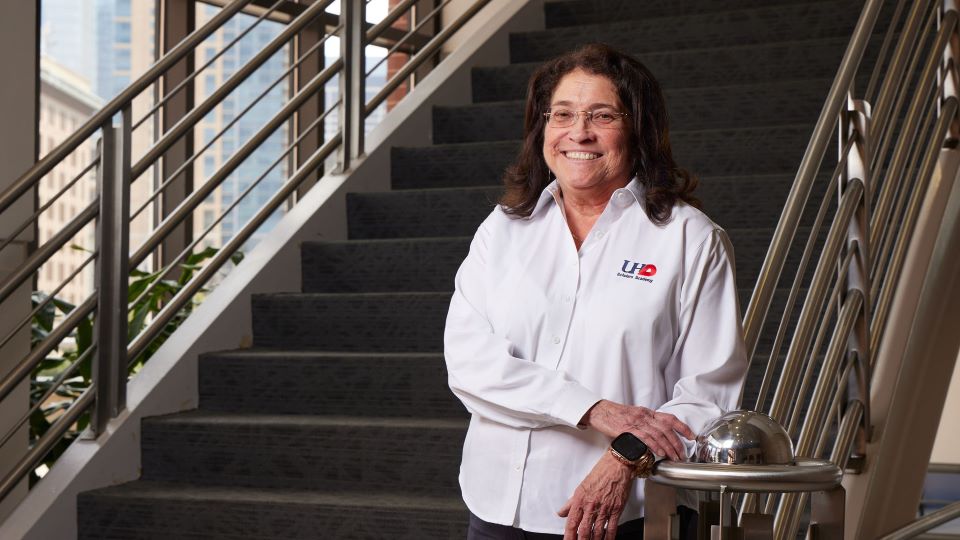 Dr. Mary Jo Parker posing in front of stairs