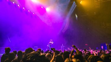 Bruno Mars sings during a concert.