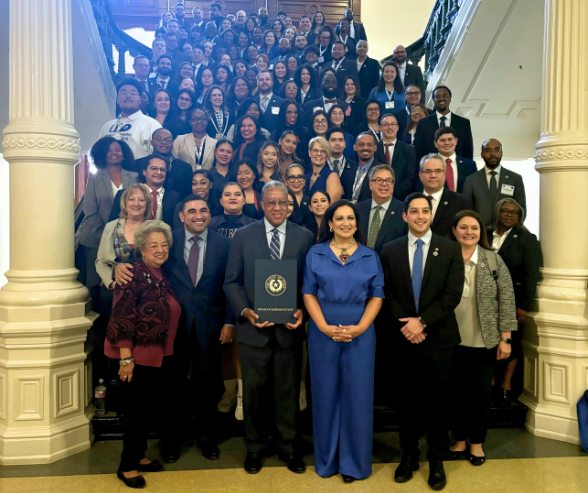 uhd staff, faculty, alum and students smile with uhd president loren j. blanchard, christina morales and armando walle inside the state capitol on feb. 26