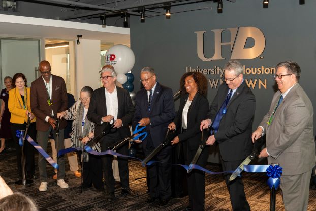 President Blanchard and members of the Downtown Redevelopment Authority cut the ceremonial ribbon at UHD's new offices at 1801 Main