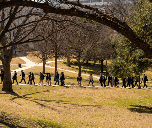 University of Houston-Downtown staff, faculty, students and alum on a walking path from state capitol to scholz garten at uhd day at the capitol in austin, texas