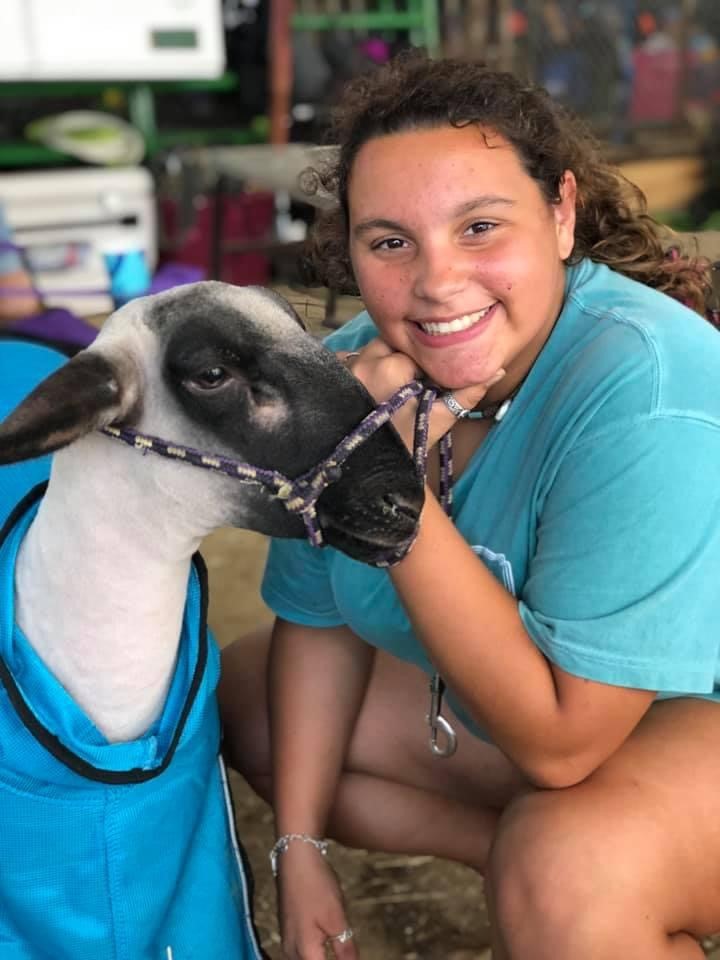 Ashlyn Pena with a lamb