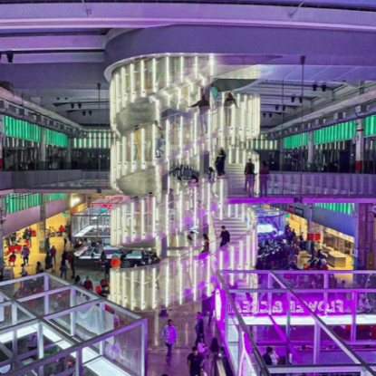 Spiral staircase that is three stories high. Photo of interior of POST Houston.